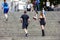 London/England - May 26 2019: A portrait of a male and a female runner, running up the stairs downtown London during the vitality