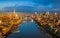 London, England - Panoramic aerial skyline view of London including iconic Tower Bridge with red double-decker bus