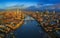 London, England - Panoramic aerial skyline view of London including iconic Tower Bridge with red double-decker bus