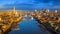 London, England - Panoramic aerial skyline view of London including iconic Tower Bridge with red double-decker bus