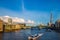 London, England - Sightseeing boats at sunset on River Thames with Southwark Bridge and Tower Bridge