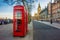 London, England - Traditional Old British red telephone box at Victoria Embankment with Big Ben