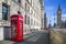 London, England - Traditional red british telephone box with Big Ben