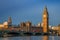 London, England - Traditional red double decker buses on Westminster Bridge with Big Ben