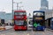 London, England, UK - December 31, 2019: Several traditional double-decker buses at the intersection behind London Bridge await