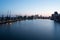 London, Essex / UK - August 23 2018. Slow shutter speed of the river Thames looking at the City Airport and a landing plane.