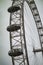 London eye half wheel with pods in cloudy sky