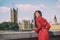 London fashion week Asian model woman at Westminster parliament, iconic british landmark Big Ben city background. Autumn