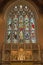 LONDON, GREAT BRITAIN - SEPTEMBER 17, 2017: The main altar and the stained glass in church St. Michael, Chester square