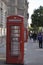 London iconic red telephone booth on sidewalk