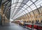 London Kings Cross Station London deserted platform with train waiting and no passengers due to pandemic lockdown essential travel