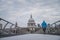 London marathon concept photo. Runner training on Millennium Footbridge, St Paul`s Cathedral in background