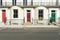 London - March 30: A row of typical town houses in London Kensington with colorful doors on March 30, 2017