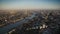 London modern architecture and busy downtown district by river Thames in aerial drone sunset panorama