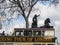 London Open-top Sightseeing Bus Tour moving near Boadicea statue chariot