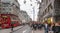 London. Regent street, Oxford circus with lots of pedestrians and cars, taxis on the road.