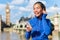 London running girl listening to smartphone music