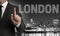 London skyline at night with businessman concept