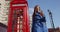 London Tourist Walking By Phone Booth Against Big Ben In - Young Professional