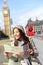 London tourist woman sightseeing holding map