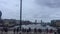 London, UK- 05/04/2019: commuters rush hour crowd people walking across Waterloo Bridge with Tower Bridge behind river Thames