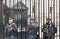 London, UK - 1st April, 2017: Police officers protecting the gate of Downing street in London, the residence of the prime