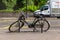 London, UK - 27 July, 2018: A long-forgotten Bicycle near the road