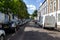 London, UK - 30 July, 2018: Perspective view on the London quiet residential street with a dead end at the end