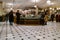 London, UK - 5th January 2023: Food Court of Harrods, one the most famous shops in the world, low level shot of customers at the