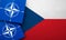 LONDON, UK - August 2022: NATO North Atlantic Treaty Organization military alliance logo on a Czech flag