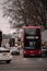 London UK February 2021 Cold vertical winter shot of a number 40 London bus waiting on an intersection, going to Dutwitch library