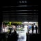 London UK. Grand Union Canal at Little Venice, Paddington. Silhouettes of people walking under the bridge, and on a boat