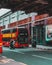 London UK January 2021 Panning shot of a popular red double decker London bus, background blurred in motion. Dark vertical moody