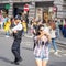 London, UK, July 14, 2019. A girl in London takes a selfie in front of police. Soft focus