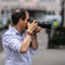 London, UK, July 14, 2019. Photographer taking pictures of sporty models near Polo Ralph Lauren shop. Free public event Regent