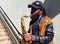 London, UK - June 21 2018 - A busker plays the saxaphone in London, at the Paddington Green underpass