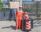 London / UK - June 26th 2019 - Pro-EU anti-Brexit protester dressed as a clown and holding `Build a bus with Boris` sign