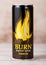 LONDON, UK - JUNE 30, 2018: Can of Burn Energy Drink Original on wood. Burn energy is made for keeping eyes open and mind sharp.Le