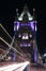 London UK, Majestic Tower Bridge at night with light trails of bus and cars, artistic long exposure night shot