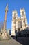 LONDON, UK - MARCH 16, 2014: Westminster Abbey and scholars war memorial column with St Margaret`s Church and Big Ben in the backg