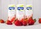 LONDON, UK - MAY 03, 2018: Pack of Alpro Soya strawberry milk drink on wooden background with fresh fruits.
