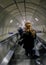 London, UK - May 5, 2017: Passengers going down the escalator