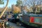 LONDON, UK - NOVEMBER 30, 2016: Little Venice with colorful barges along canals and Catholic Apostolic Church in the background