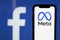 LONDON, UK - October 2021: Facebook social media company changes its corporate name to Meta