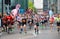 London, UK people running in London Marathon. People cheering the sportsmen in Canary Wharf area