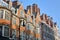 LONDON, UK: Red brick Victorian houses facades in Mount Street borough of Westminster