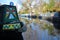 LONDON, UK: Reflections in Little Venice with colorful barges along canals