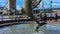 LONDON, UK - SEPTEMBER 26, 2016: Dolphin fountain and Tower Bridge on a summer day