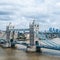 London, UK - Squared image of Tower Bridge, skyscrapers of Canary Wharf and the financial district