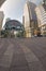 London, United Kingdom - April 06, 2007: Empty road near Canary Wharf tube station entrance, tall glass and steel skyscraper -